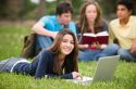 girl-studying-on-grass