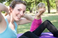 woman-friends-exercising-to