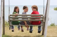 3_kids_on_a_swing